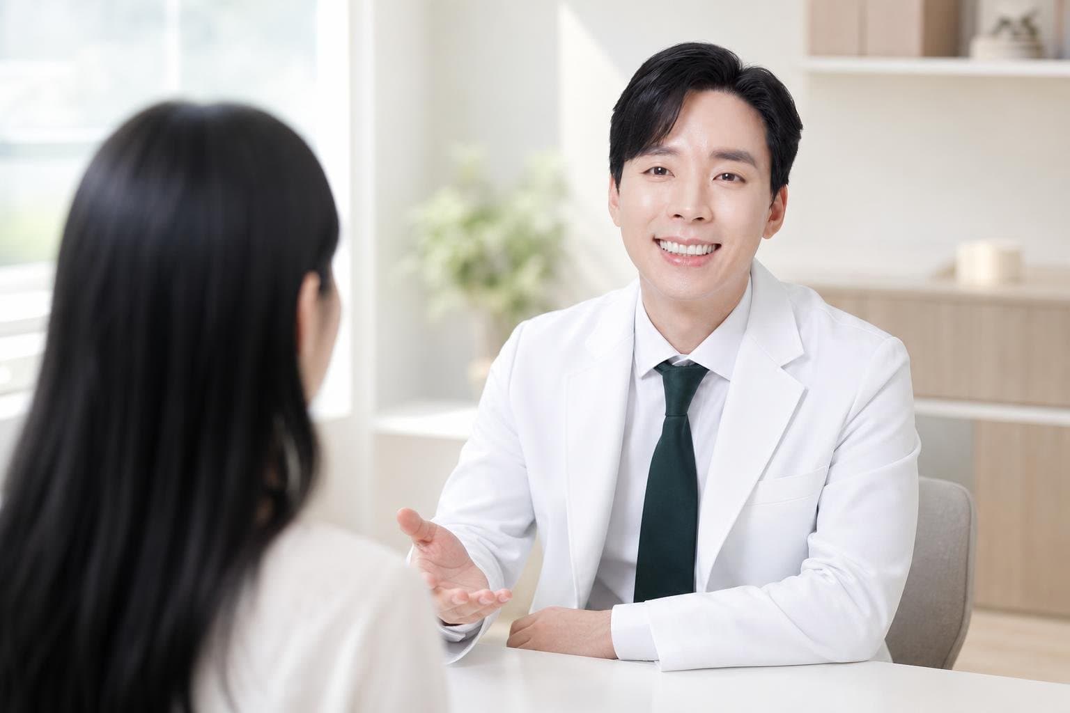 Dr. Min Jeong with a patient at REDI Dermatology in Seoul, discussing agnes laser
