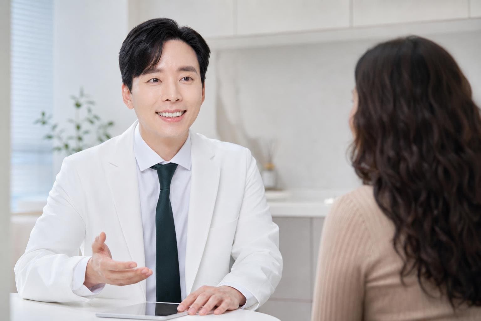 Dr. Min Jeong with a patient at REDI Dermatology in Seoul, discussing juvelook price korea