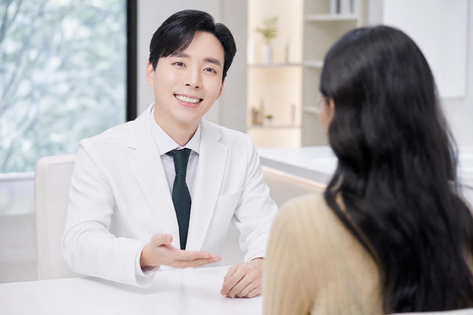 Dr. Min Jeong with a patient at REDI Dermatology in Seoul, discussing korean laser treatment