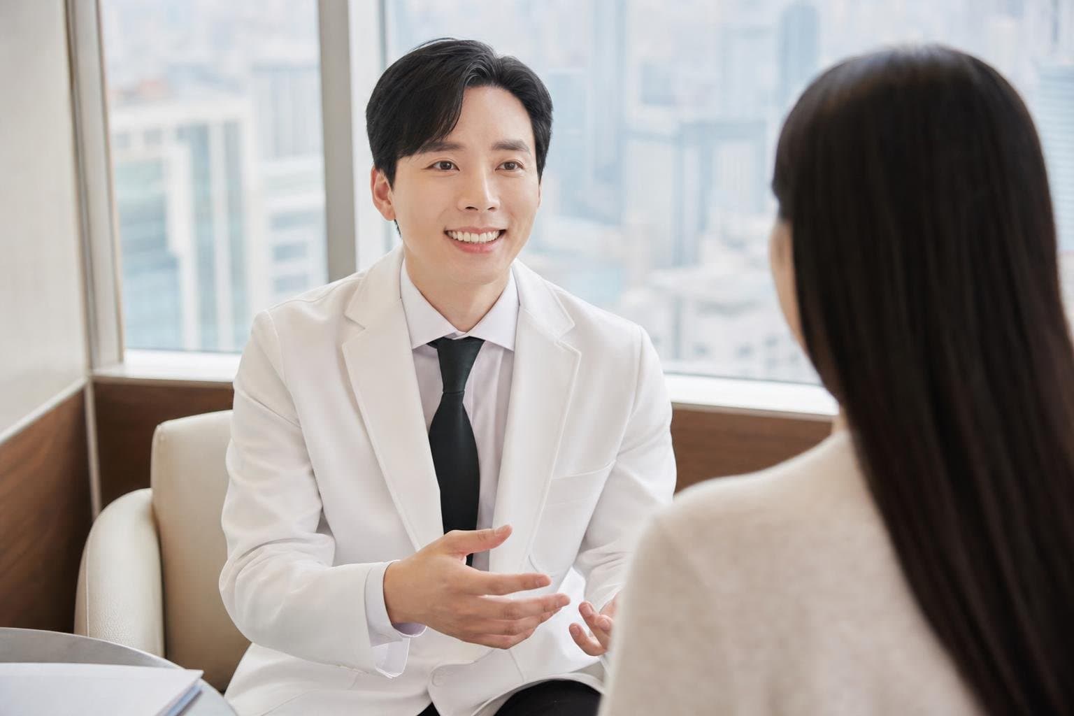 Dr. Min Jeong with a patient at REDI Dermatology in Seoul, discussing skin treatment downtime korea