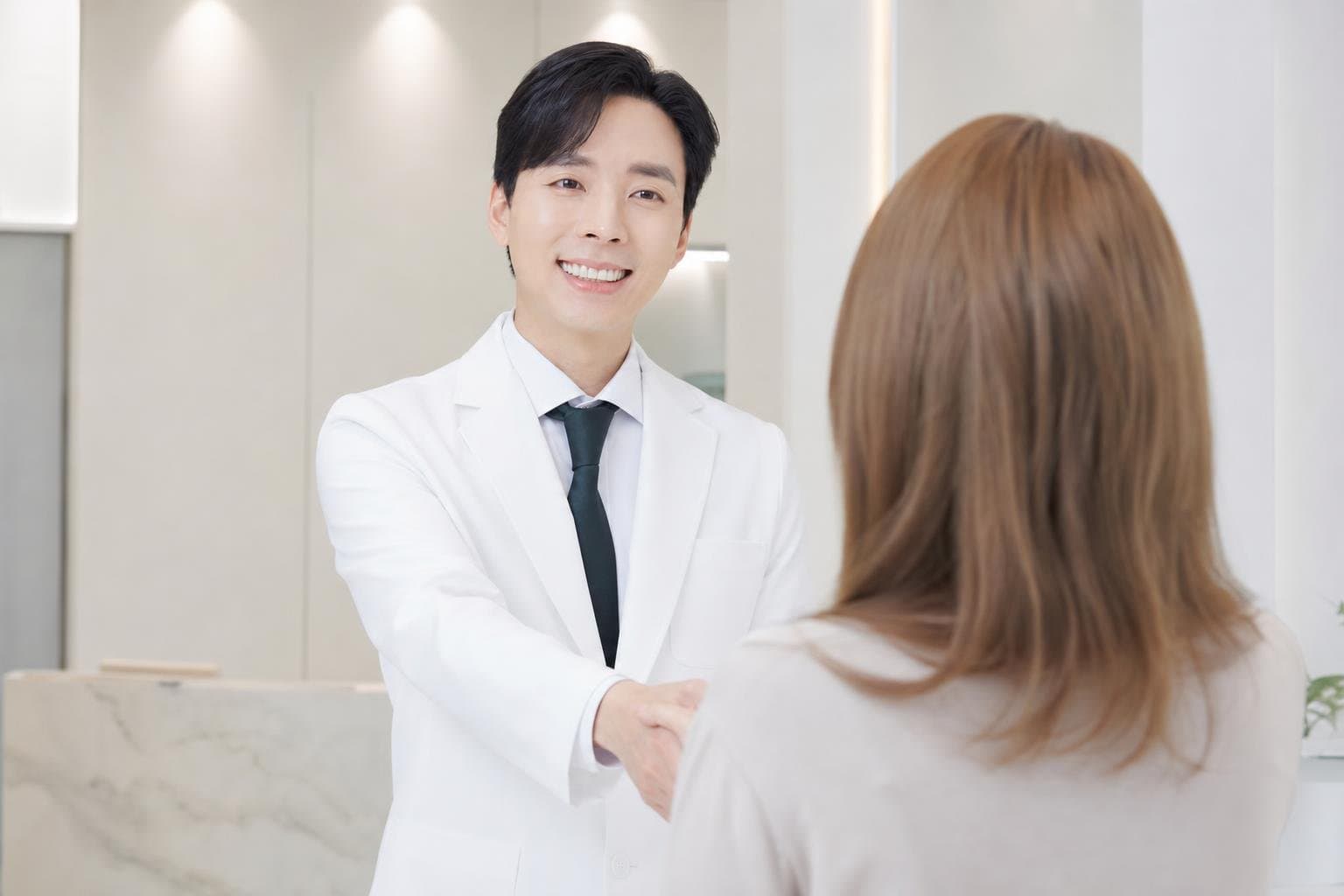 Dr. Min Jeong with a patient at REDI Dermatology in Seoul, discussing tune face korea
